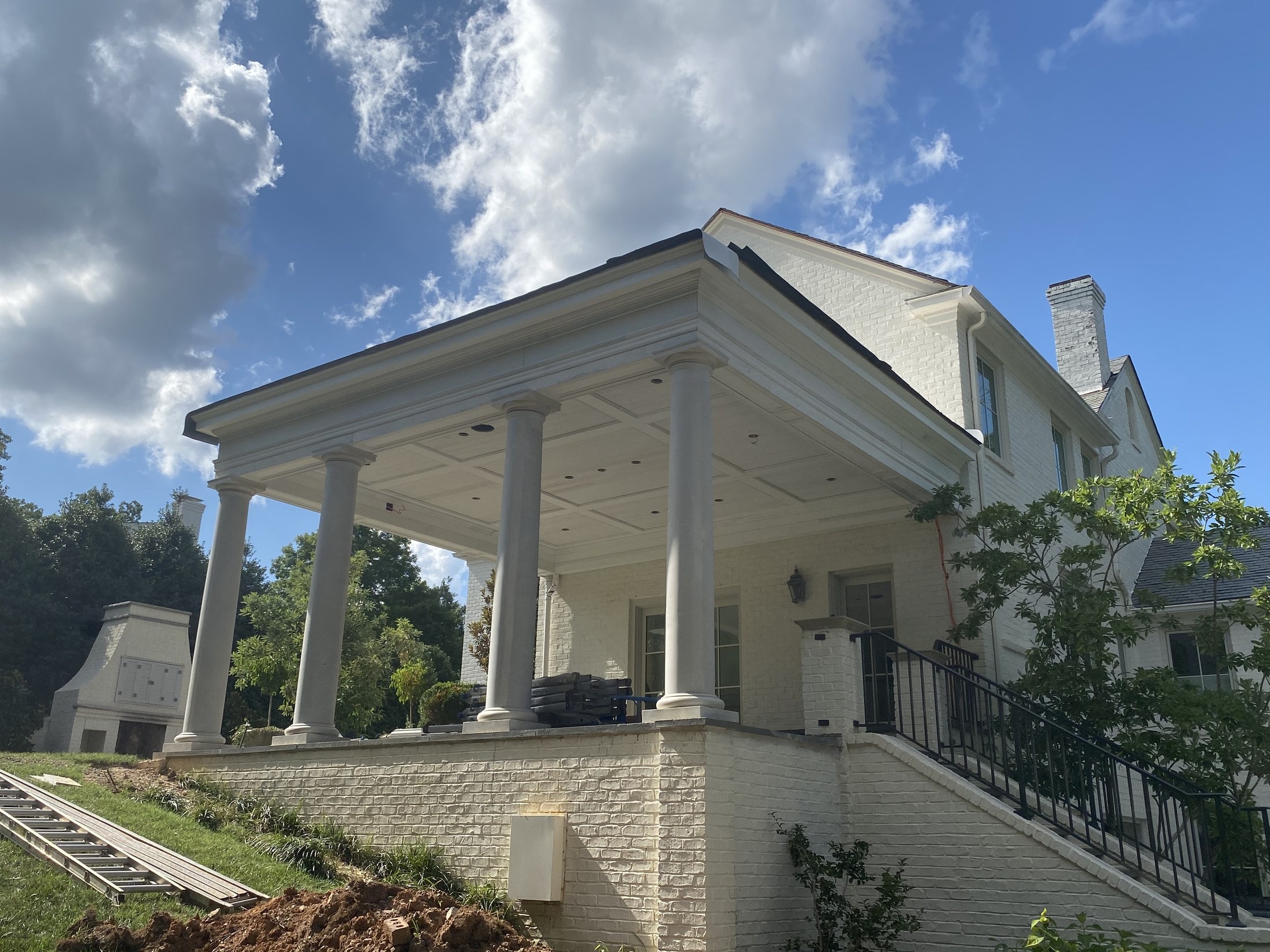 Columned exterior entry with finished trim detailing