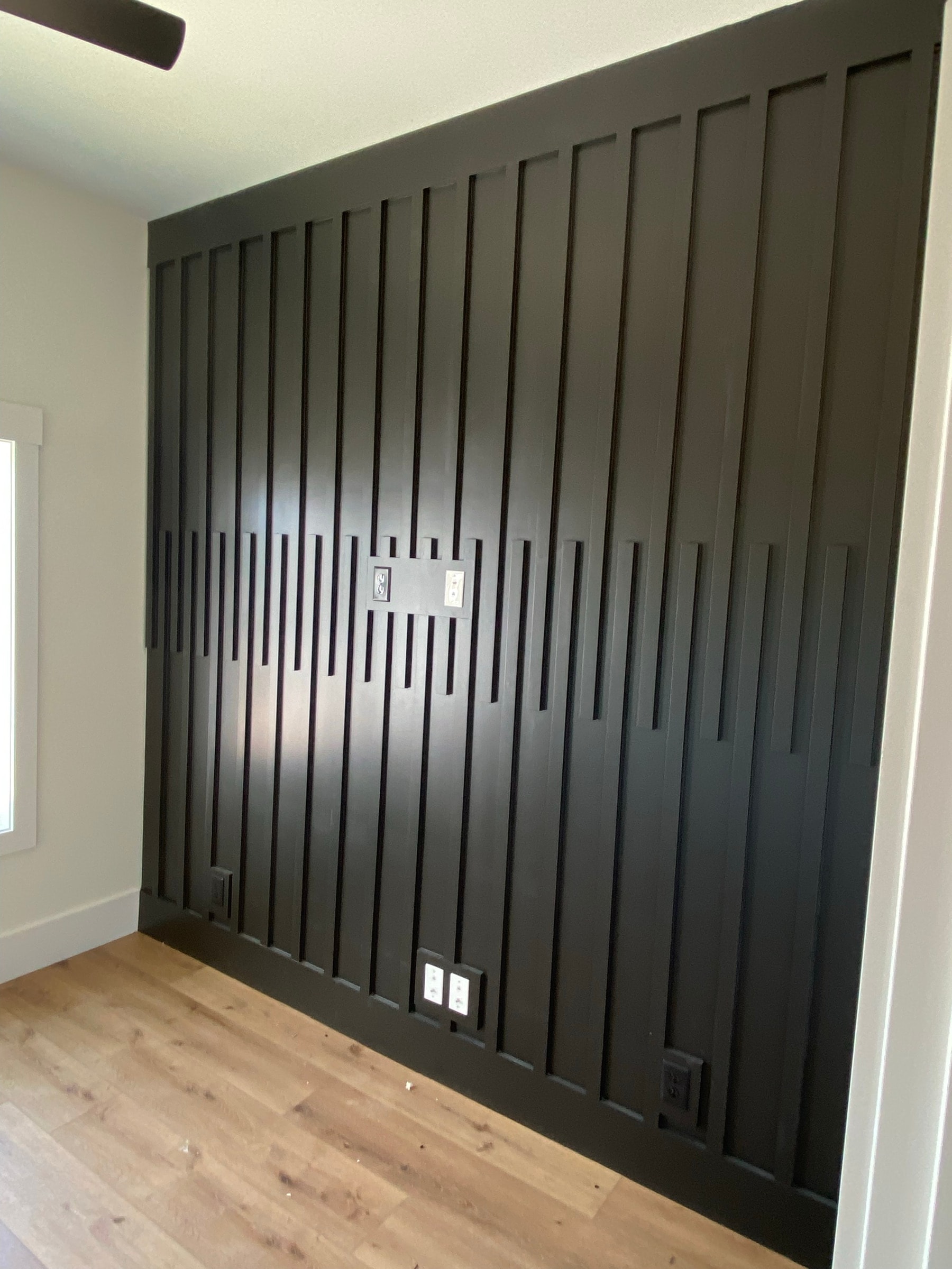 Dark vertical-slat wood accent wall