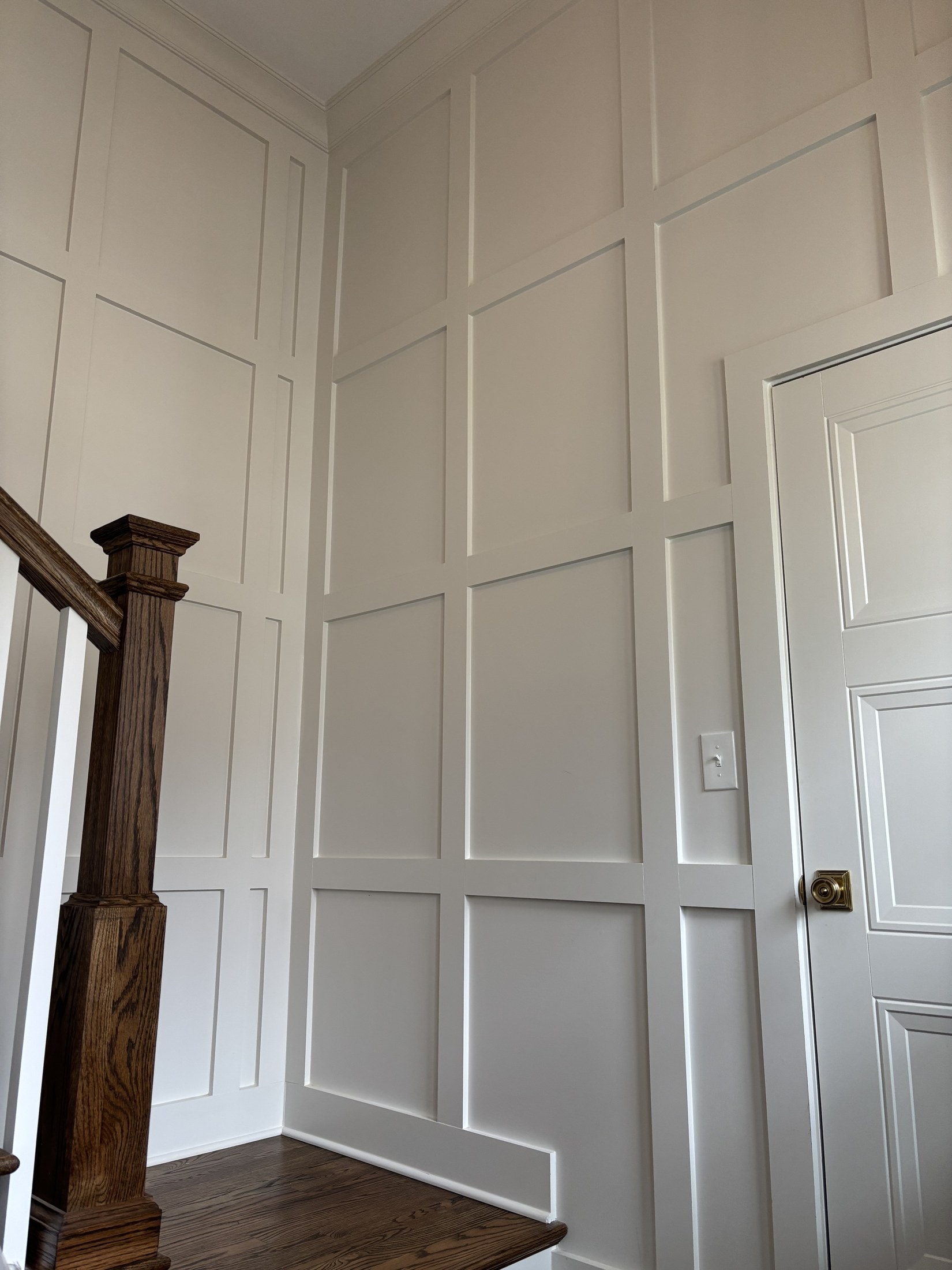 Picture-frame wainscoting with chair rail in a dining room