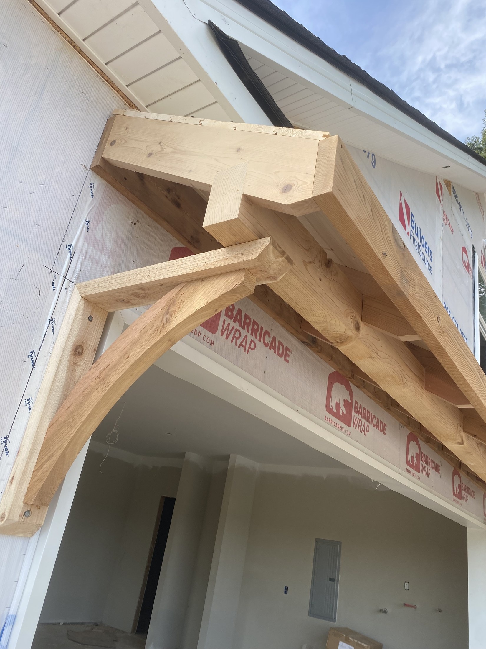 Custom Douglas-fir eyebrow arch over a garage