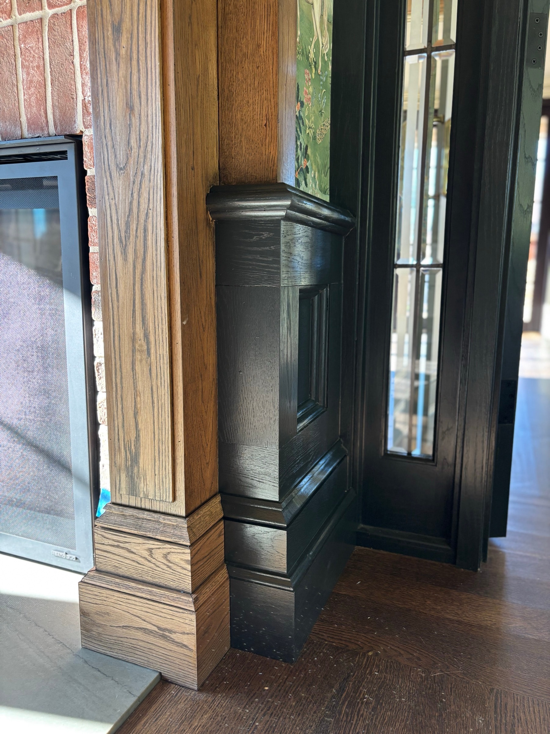 Stain-grade wood-paneled study corner with a window